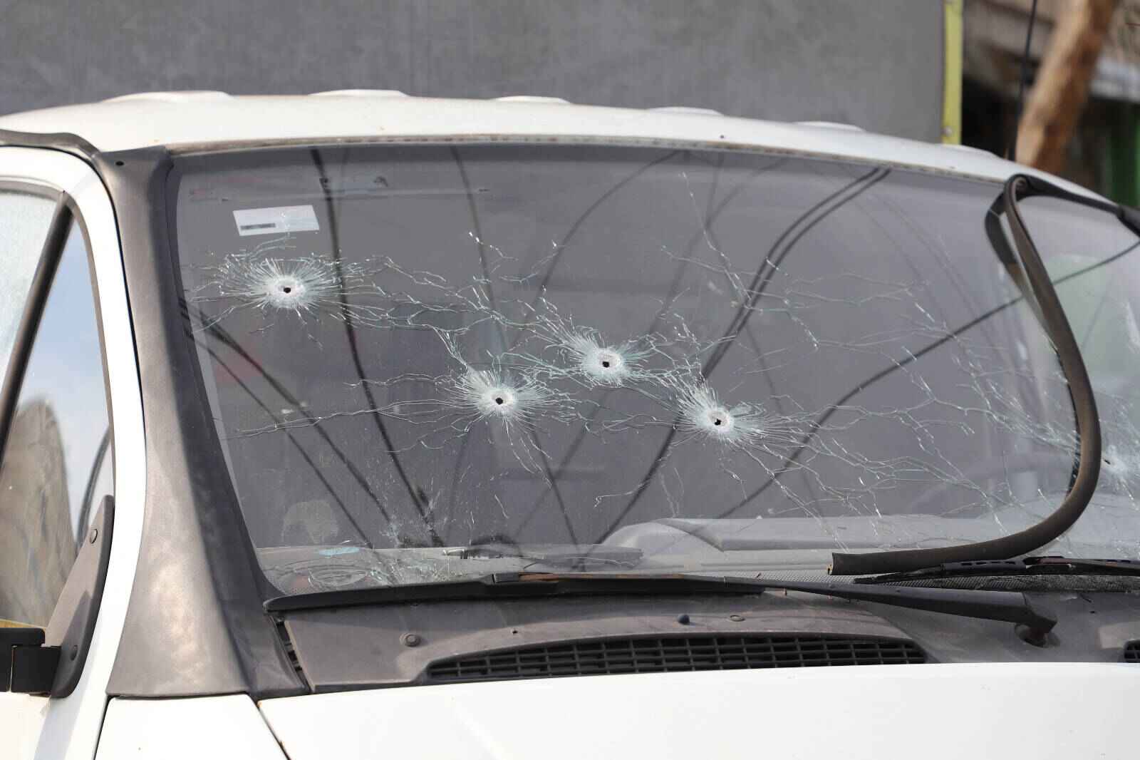 Car windscreen with bullet holes