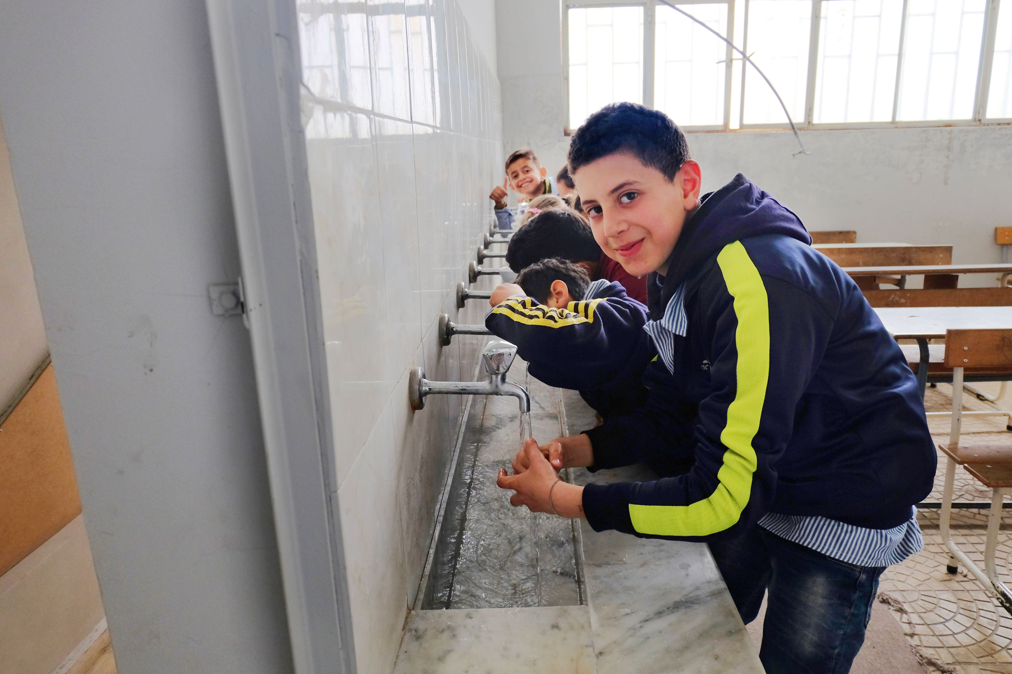 Title Lebanon - Boys using hand washing facility